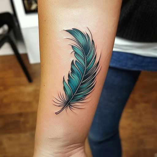 Feather with turquoise gradient for small forearm tattoo