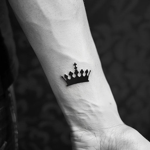 Modern minimalist king crown tattoo with a single black line
