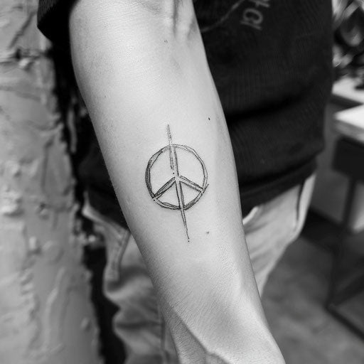 Classic peace tattoo sketch with a timeless peace sign in black outline