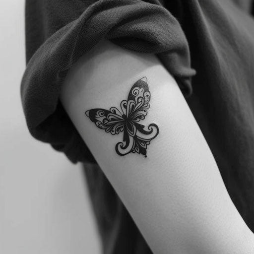 Small tattoos for women in the style of Ami James with a delicate butterfly