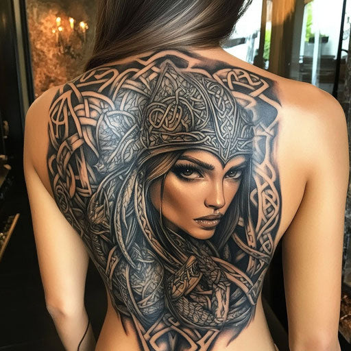 Female back tattoo in the style of Glenn Fabry with Celtic warrior and intricate knotwork