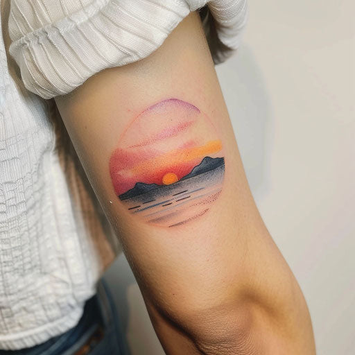 Watercolor sunset tattoo