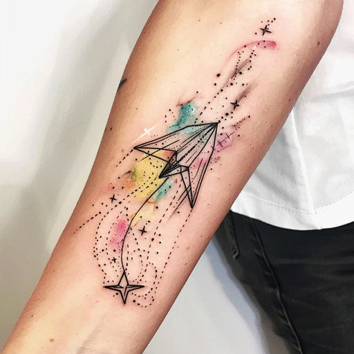 Watercolor tattoo sketch of a paper airplane with a trail of stars