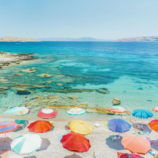 Beach scene at Golden Beach (Paros), Greece with colorful umbrellas and crystal-clear water