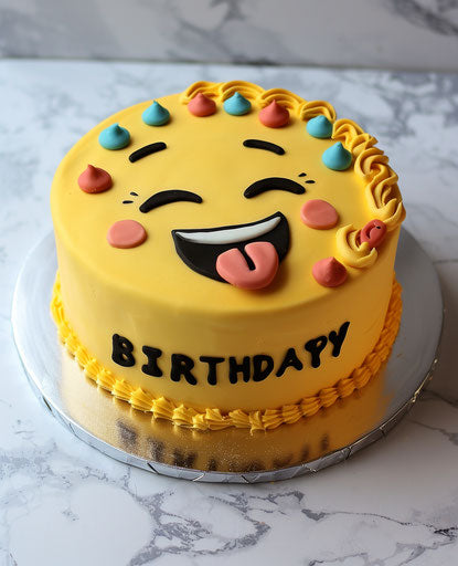 Yellow cake with winking emoji and sticking out tongue