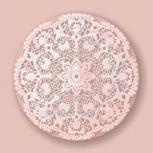 Round logo with delicate lace design on soft pink background