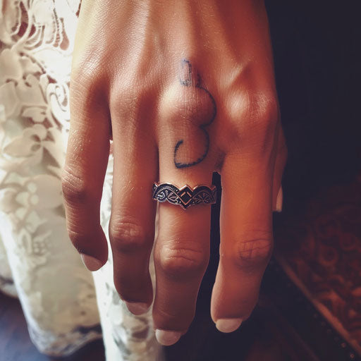 Wedding ring tattoo with heartbeat pattern design