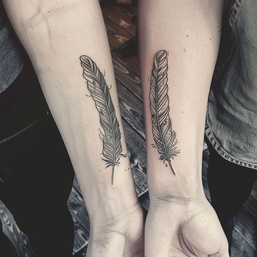 Matching sister tattoos of feathers and birds