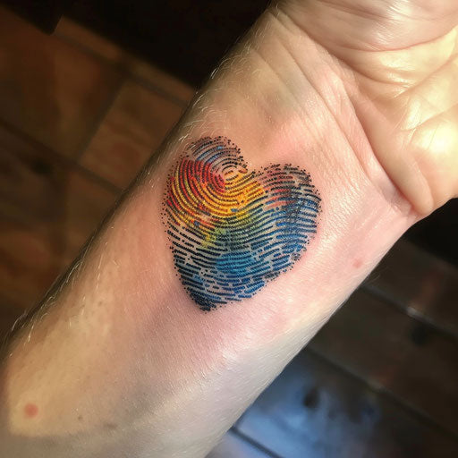 Impressionist fingerprint heart tattoo in vibrant colors