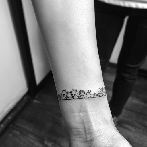 Whimsical flat tattoo sketch of a wrist band with cartoon animals in a playful sequence