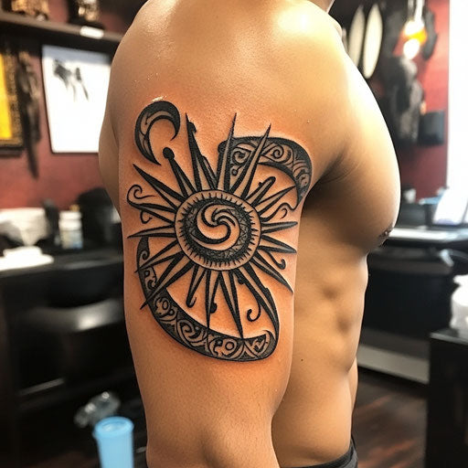 Tribal tattoos for men with a tribal sunburst on bicep