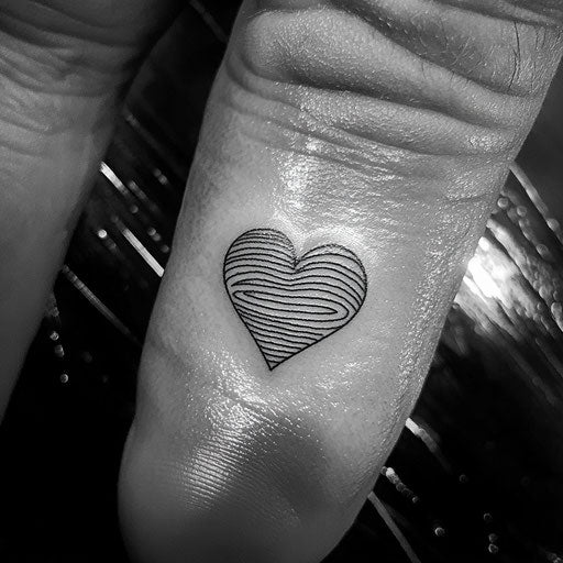 Fingerprint tattoo with delicate heart outline, Guy Aitchison style
