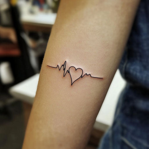 Minimalist small heart and heartbeat line tattoo on white background