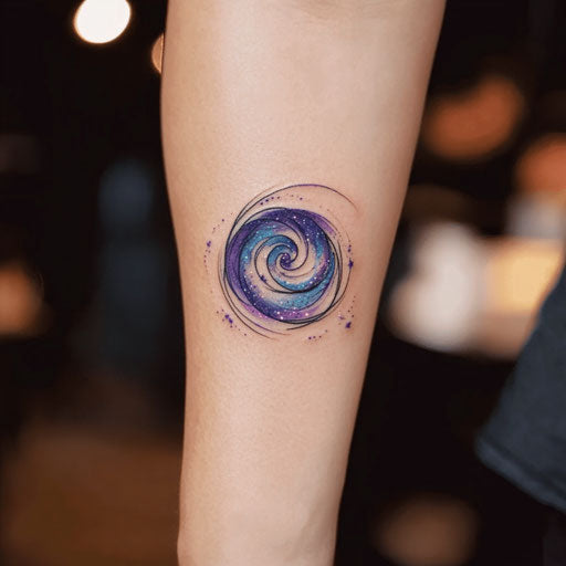 Cool forearm tattoo with cosmic galaxy swirl