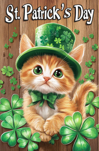 Adorable kitten with green hat surrounded by clovers