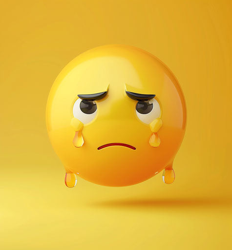 Sad emoji on yellow background