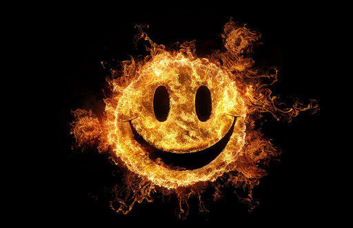 A fire cartoon of a smiley on a black background