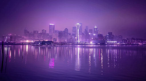 Nighttime skyline of Seattle with Space Needle and Rainier