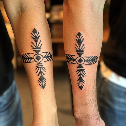 Small matching tattoos of tribal armbands in the style of Sailor Jerry