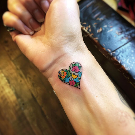 Tiny heart wrist tattoos, Ed Hardy inspired