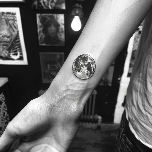 Tiny wrist moon tattoos, Peter Jackson style