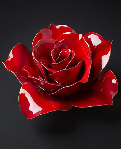 Vibrant red rose on deep black background