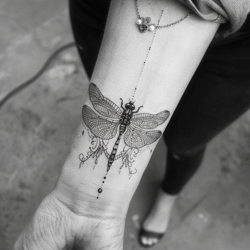 Tattoo sketch of an elegant dragonfly with intricate lace patterns for wrist coverup tattoo for women
