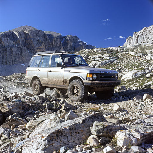 Modified off-road vehicle navigating rocky mountain trail