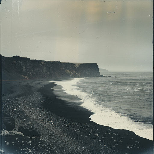 Black sand beach with dramatic waves against rocky shore