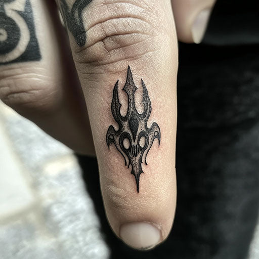 Tiny finger tattoos in the style of Gerald Brom featuring eerie gothic symbols