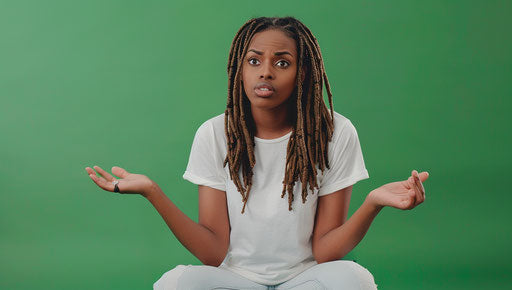 African American woman sitting, confused, asking for help