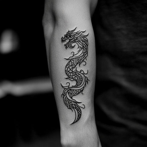 Tribal dragon wrapping around inner forearm