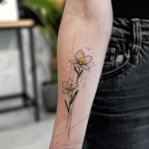 Contemporary minimalist tattoo of a Narcissus with gold foil on white background