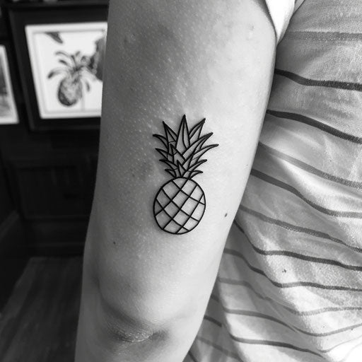 Minimalist pineapple tattoo design in black on white