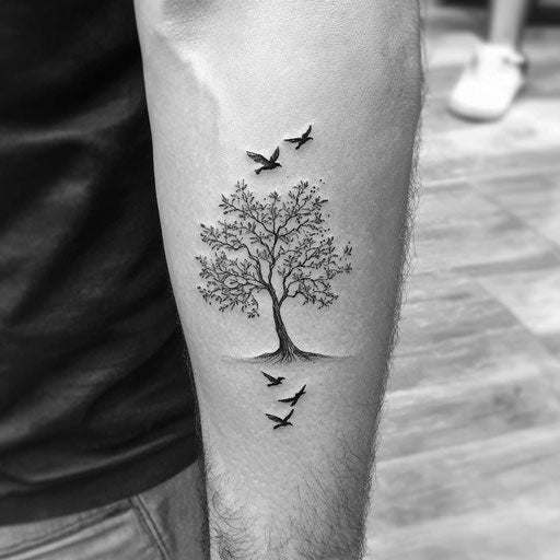 Tree tattoos for men showing leaves turning into flying birds