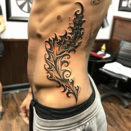 Rib tattoos of tribal flames