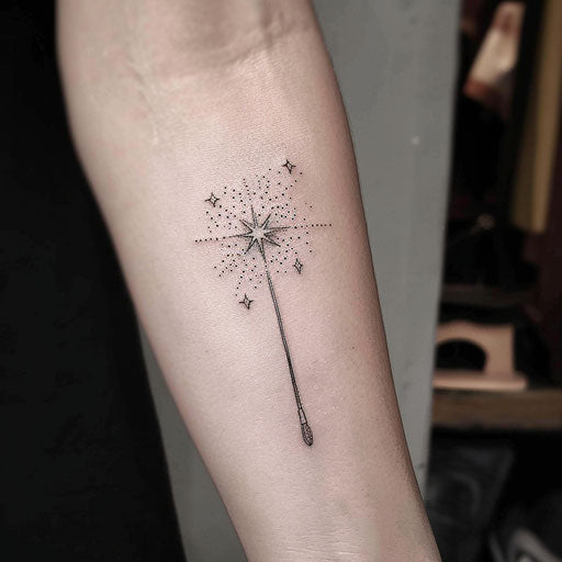 Minimalist flat tattoo sketch of a magic wand casting sparkling stars