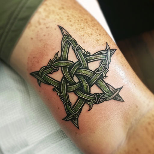 Celtic knot-themed nautical star tattoo with green and black lines