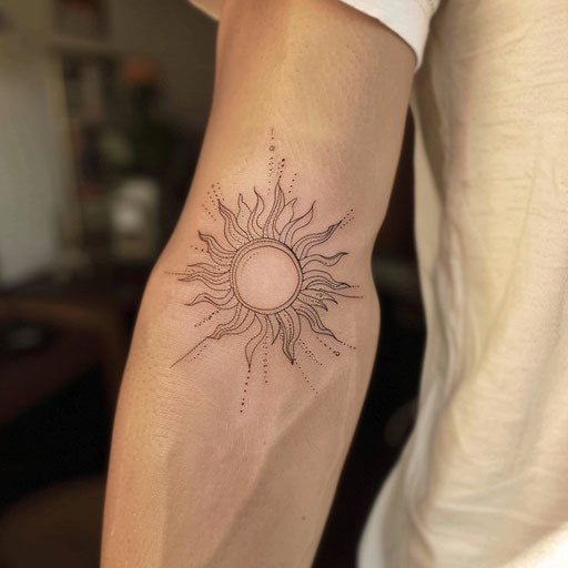 Minimalist sun in fine line tattoo