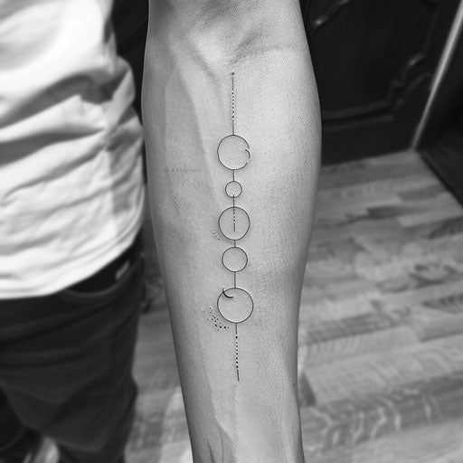 Minimalistic tattoo of moon phases in simple linework