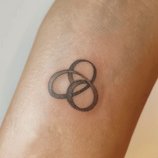 Small black infinity symbol on white canvas