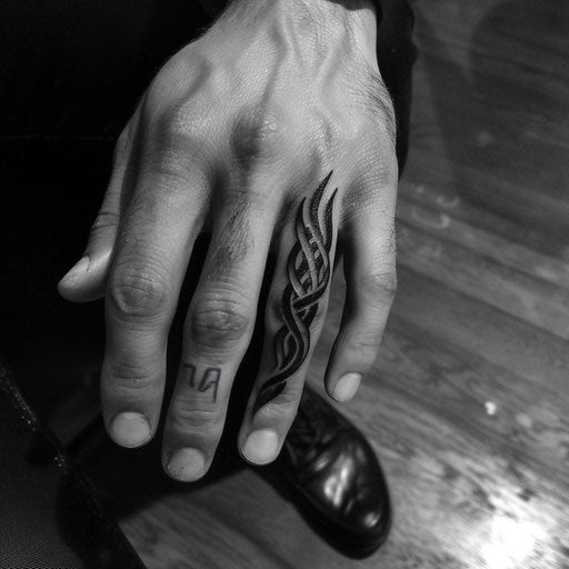 Wedding ring tattoo with small fire symbol design