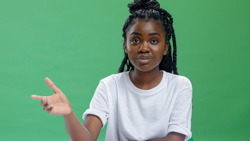 Confused African American woman, open hand gesture, 20s, white t-shirt.