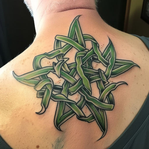 Celtic knot-themed nautical star tattoo, green and black lines