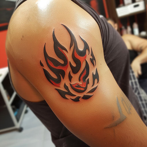 Bicep tattoo of tribal flames, Humberto Ramos style