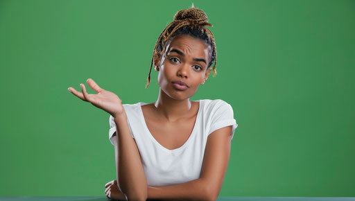 Confused African American woman sitting, hand raised