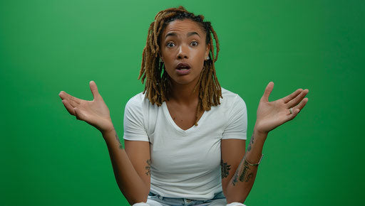 African American woman sitting, looking confused, asking for help