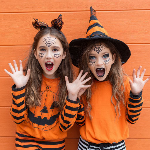 Joyful Girl in Halloween Costume with Pumpkin Design
