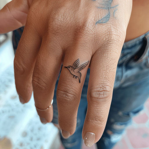Flying bird tattoo on the ring