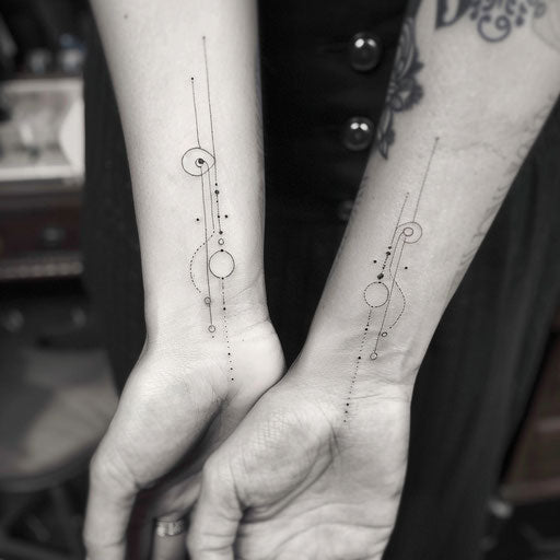 Minimalist line and dot tattoos for mother and daughter